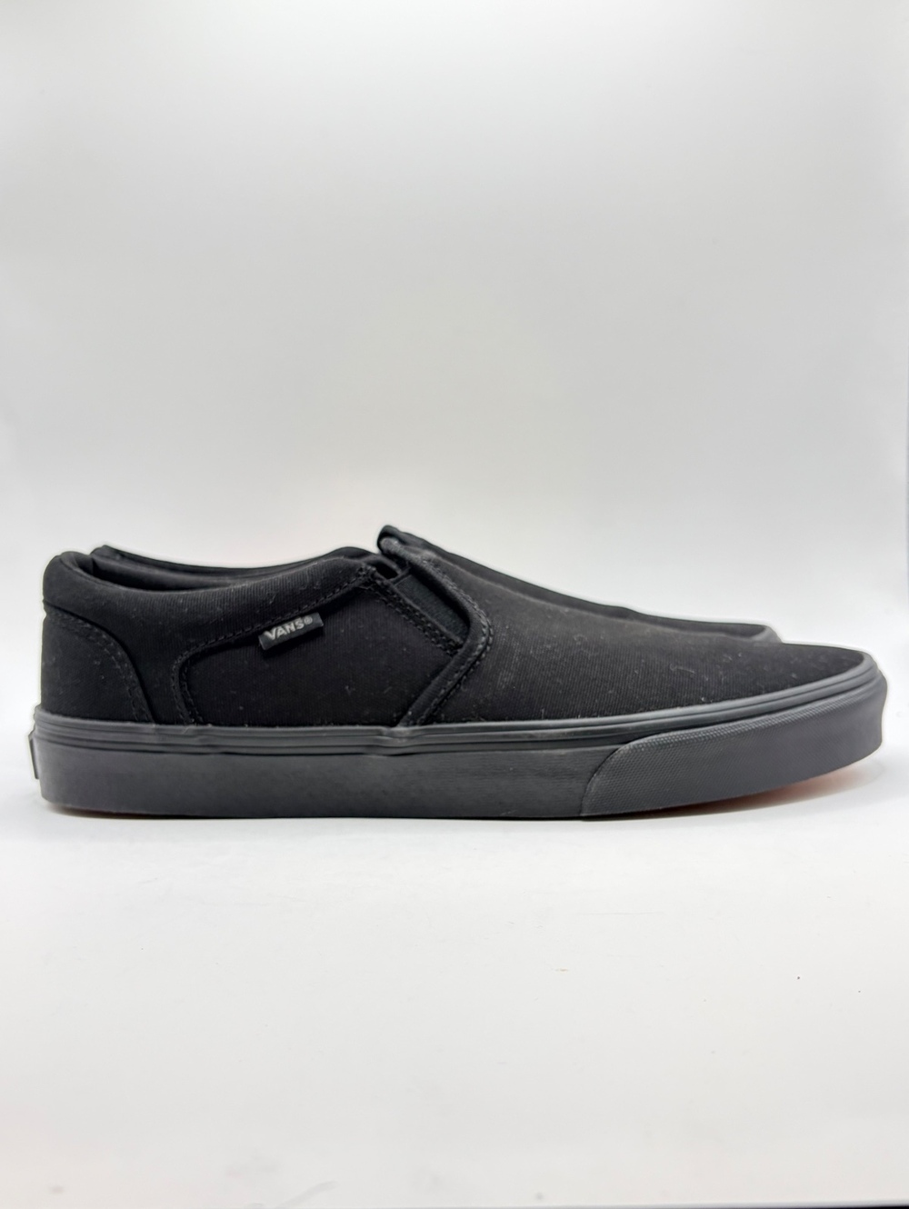Vans Asher slip-on sneakers in triple Black